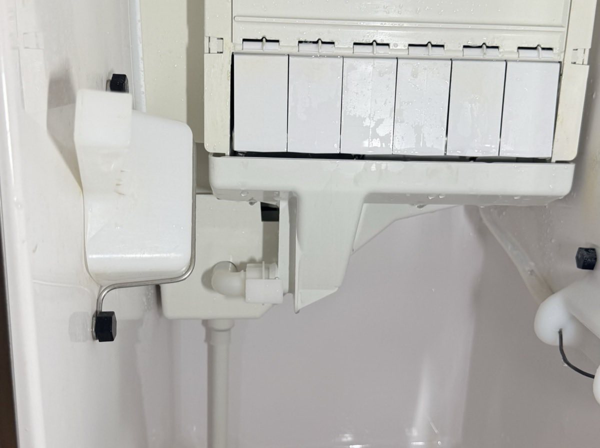 Ice maker evaporator chamber, water trough and distribution tube after a full clean and sanitize