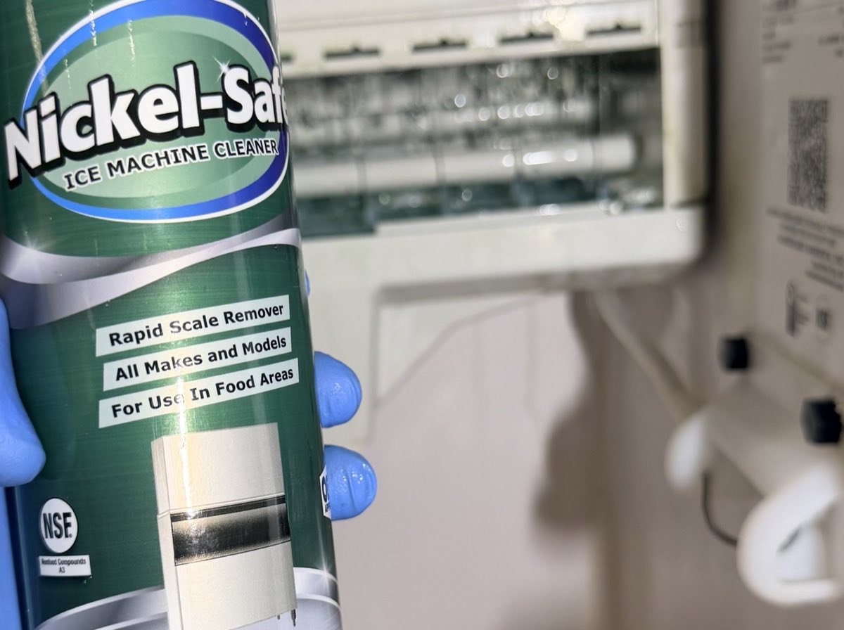 NSF-listed nickel-safe ice machine cleaner being used to remove scale from an ice maker evaporator