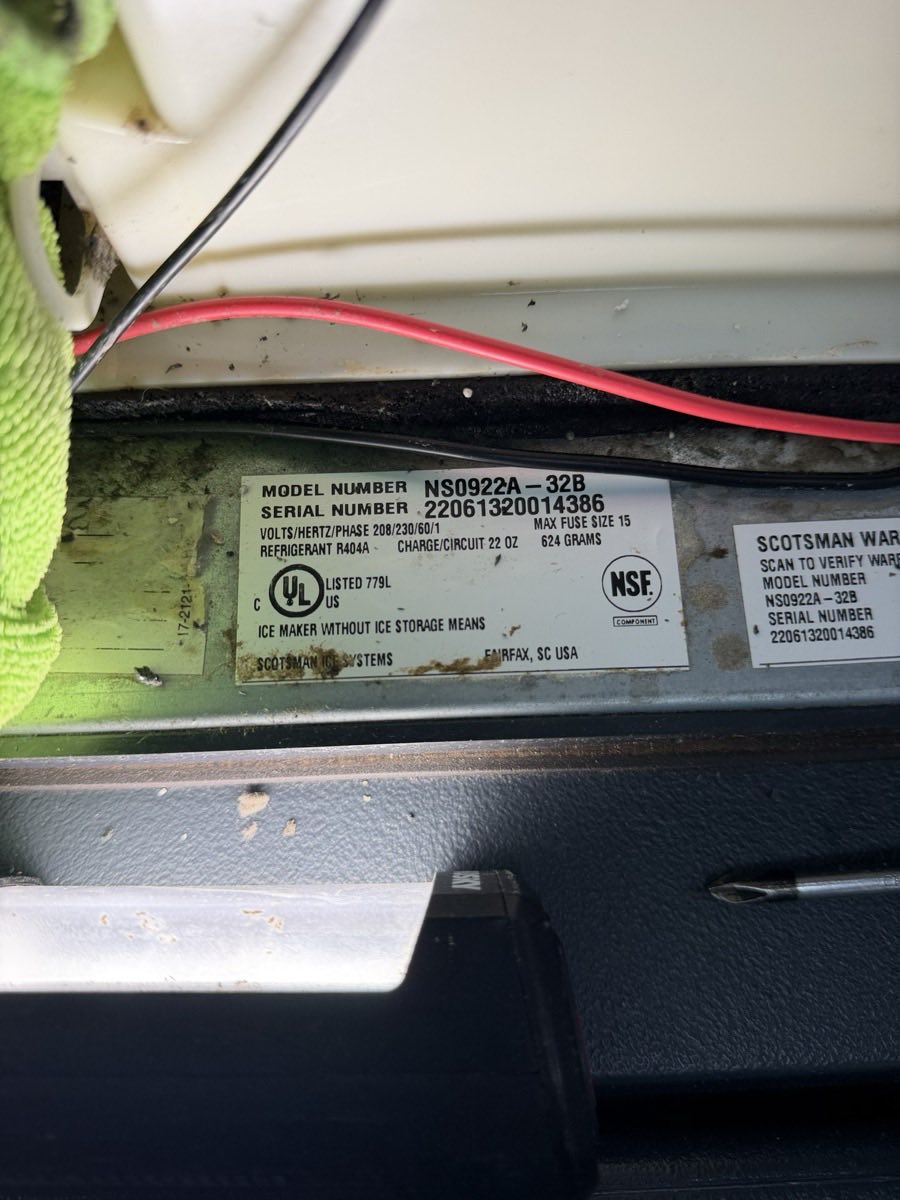 Scotsman ice machine nameplate showing model number, serial number, refrigerant type and charge weight
